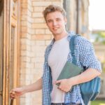 student going into a building